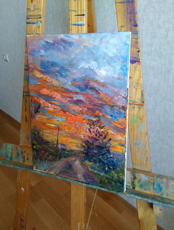 Картина "Дачный закат" на мольберте.